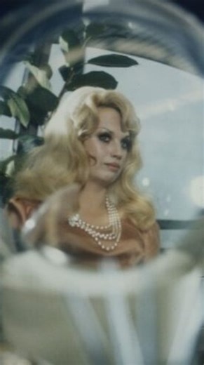 Film Paranoia on Instagram: "Rainer Werner Fassbinder’s *World on a Wire* presents a cold, hypnotic vision of reality as something fragile, artificial, and endlessly reproducible. Set in a sleek, bureaucratic future, the film follows a computer engineer who begins to suspect that the world he inhabits is itself a simulation, built to be observed, manipulated, and discarded. Fassbinder stages this revelation not as a burst of science fiction spectacle, but as a slow, unsettling erosion of certain