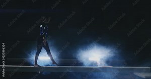 Feet of gymnast on balance beam