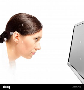 Woman staring at a computer monitor on a white background Stock Photo - Alamy
