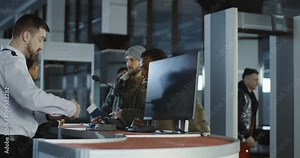 Multiracial passengers in airport having biometric control with fingerprints on screen passing for flight. 4K shot on Red cinema camera.