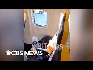 Passenger almost sucked out of plane after window breaks during flight