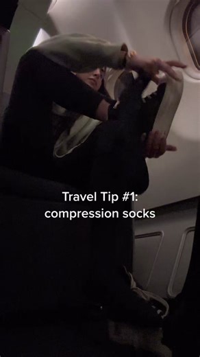 Huge compression socks girl. Long or short haul flights 🫶🏻 #traveltips #swelling #bloating #tips #flight #planes #travelhacks #compressionsocks