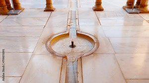 The Alhambra Palace - The Court of the Lions Nasrid Palace, featuring a large fountain held up by 12 marble lions, Granada, Andalucia, Spain
