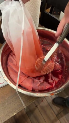 Mashing Raspberries #homestead #diy #wine #raspberry #winemaking @KandTHomestead
