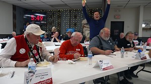 Around 1982 is when the Madison, Minnesota, Chamber of Commerce chose to declare themselves as the “Lutefisk Capital of the USA.” Since then, to defend that title, they’ve hosted an annual lutefisk eating contest, where participants gather to chow–or choke down pounds of the once common food of dried cod cured in lye before being steamed. Postcards captures the 50th anniversary of this contest with over 50 contestants new and old–including long-time champion Jerry Osteraas. | Postcards