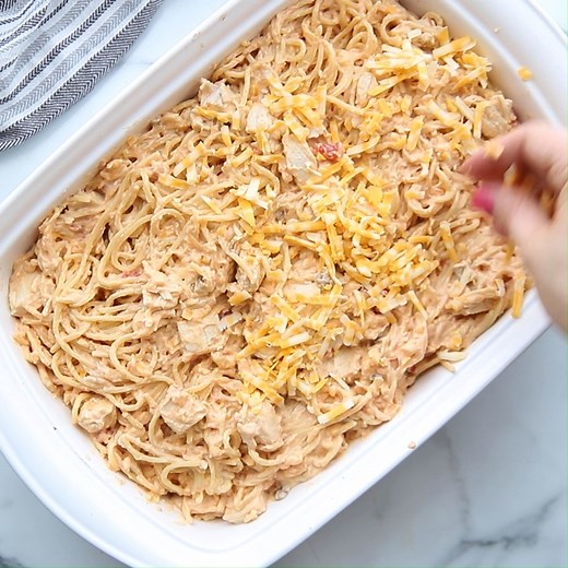 Full Recipe: https://lilluna.com/chicken-spaghetti/ This easy Chicken Spaghetti recipe calls for chicken, spaghetti noodles, cream of chicken, salsa, sour cream and cheese, making it the epitome of comfort food! | Lil' Luna - Kristyn Merkley