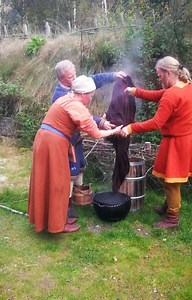 Plant dyeing with madder root. Rinsing the cloth after the finished process. | Viking Valley Gudvangen