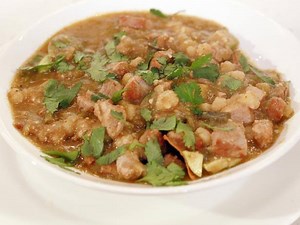 Step up your pork posole with a bottom-of-the-bowl surprise. Save this recipe: http://www.cooktv.com/5t5bm | Cooking Channel