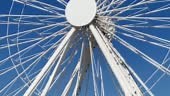Giant white Ferris Wheel in French Antibes, skywheel rotation against...