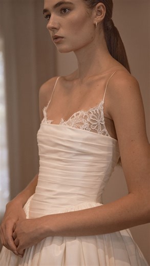 V A G A B O N D Bridal on Instagram: "✨ Introducing SYLVIE — from the PARADIS Collection ✨ At once romantic and subtly architectural, Sylvie’s bodice is wrapped in soft, directional ruching that gently sculpts the torso before dipping into a pointed dropped waist. A Chantilly lace bralette peeks out from beneath the ruched satin, its delicate scalloped edges tracing the neckline like a whisper of lingerie — lending the gown a quietly seductive undertone. Fine, barely-there straps complete the lo
