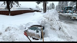Snowplow driver finds woman alive inside car buried in snow