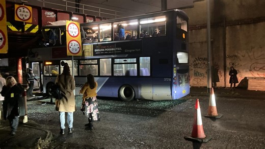 Passenger critically injured after double-decker bus crashes into Glasgow bridge