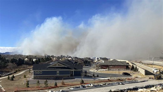 Wind-fueled wildfires burn hundreds of homes in Colorado as thousands flee