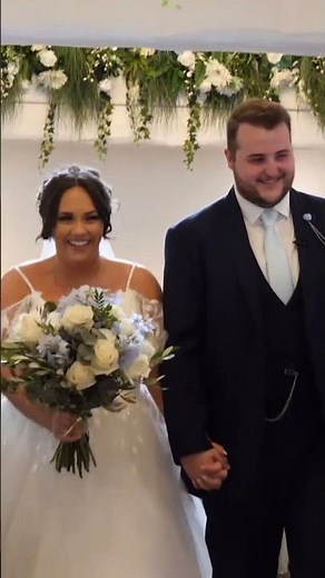 bride and groom walk up the aisle