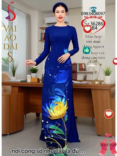 Wearing a stunning sapphire blue ao dai (traditional Vietnamese dress) for a meeting with busines...