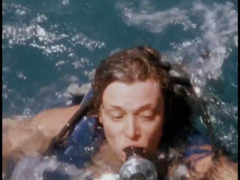 Beautiful female scuba diver panics underwater, Piranha II Movie 1981