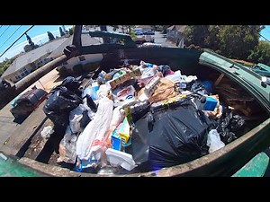 Waste Management front load commercial garbage truck