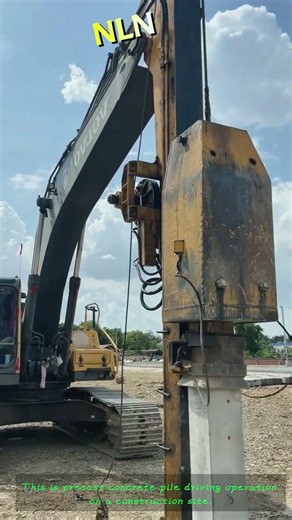 Concrete Pile Driving: Excavator-Mounted Hammer Driving Precast Foundation Piles