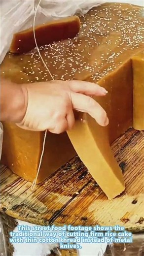 Cutting brown rice cake with thin cotton thread traditional snack making