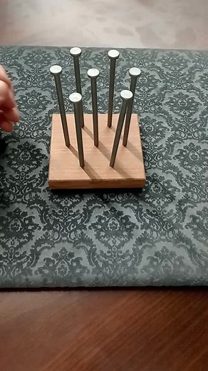 How to Balance Six Nails with a Classic Puzzle