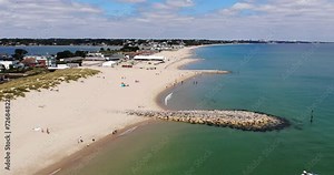 Sandbanks Beach in Dorset, UK With Beachfront Properties. Aerial Pull Back Shot
