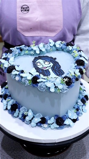 Corpse bride 🩵 - my favourite Tim Burton movie! I put my heart and soul into this cake. Hoping you love it as much as I do! 🥹 8 inch @frostform heart kit and colourmill in bluebell, royal, navy and black from frostform.com- use code FROSTLOVE10 for a discount at the website checkout Piping tips: D66, 67,17, 30 Rose and butterfly molds linked to my amazon storefront-link in comments #corpsebride #timburton #halloweencake #heartcake #cakeideas #cakedecorating #loveisbakeable | Liz Nicolaou