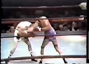 In this footage from 1974, Art Hafey of Stellarton, Nova Scotia, evades Ruben Olivares' right hand before landing one of his own at the Forum in Ingelwood, California. Olivares went on to win a split decision. It was a close bout, with Richard Steele's 10-2 scorecard for Olivares feeling too wide. Judge Eddie Fierro had it 8-4 for Hafey, while judge Dick Young saw it 7-5 for Olivares. This was a rematch of their 1973 bout, which Hafey won by KO. Unfortunately, there was no rubber match. Hafey's 