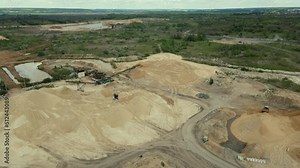 Sand extraction at quarry. Operation of machinery in open pit mining of sand