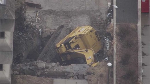 Excavator falls into hole during demolition of Courthouse Square in City of Washington, Pa.