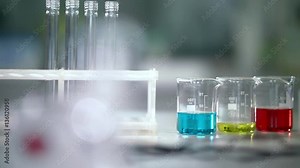 Lab flasks and measuring cups in medical laboratory. Research laboratory glassware in medical lab. Chemical liquids in laboratory flasks at pharmaceutical lab. Medical laboratory equipment Stock Video