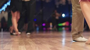Tango dancers feet while dancing close-up