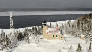 Beautiful Lighthouse on winter landscape. Overlooking Lake Superior one of the USA's Great Lakes.