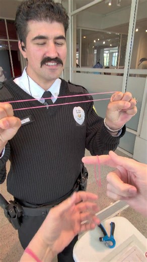 Security guard shocked by rubber band magic trick
