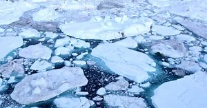 Climate Change and Global Warming - Icebergs from melting glacier in icefjord