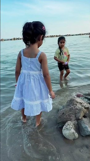Piku splashes water with joy at the beach. #torontolife #fun #beachtime #instabeach #kids