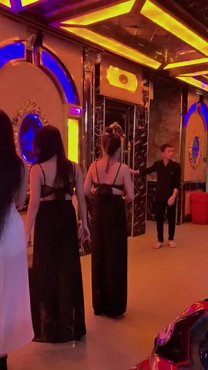 Elegant Evening Gowns in Luxurious Club Ambiance