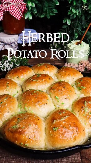 Herbed Potato Rolls🥖A Hobbit’s Pantry🧈As late spring turns to summer, the hobbits of the Shire are busy harvesting their garden crops and stocking their pantry for the coming months. Our first pantry item is a homemade garlic scape butter - but before we store it away for winter, this compound butter is well-paired with soft herbed potato rolls for a late spring treat! Brushed with the garlic scape butter and packed with fresh herbs, these potato dinner rolls are baked until golden and served 