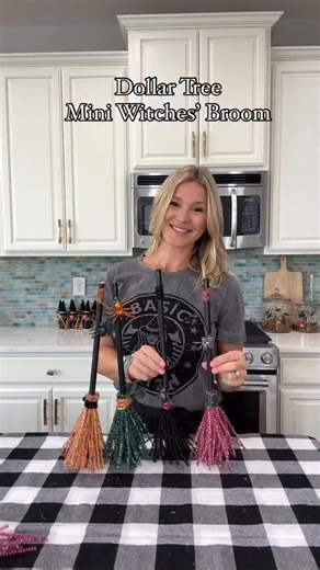 Dollar Tree Witches Brooms -pack of wooden dowel rods (paint them black) -tinsel stems in your favorite color -pack of spiders -black paint #dollartree #halloween #diy #witch #broom #foryou | Laura Jeanne