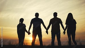business team. community hold hands together silhouette at sunset unity. team group of people hands. teamwork workers carry out put your hands up. teamwork partnership in the company working business