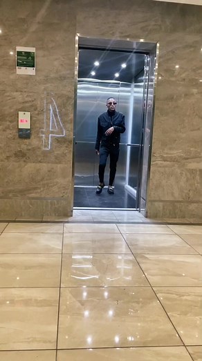 Stylish Attitude in an Elevator Setting