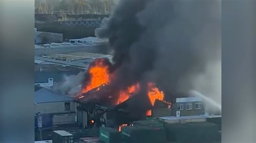 Huge fire rips through warehouse in west London