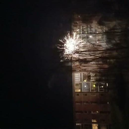 bulilding getting hit by fireworks [window cracked]