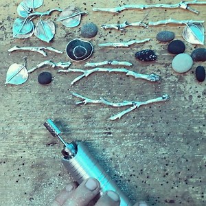 62 reactions · 4 comments | I’m working on a Sticks and Stones cuff. This time lapse shows how I take the silver branches I fused and reticulated and shave off all the excess bumps and unwanted blemishes. Next step will be to texture each branch before soldering. . . . . . . . . . . . . . . #nicoleringgold #handfabricatedjewelry #silversmith #timelapse | Nicole Ringgold Jewelry Designs | Facebook
