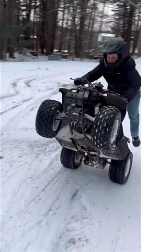 EV doing a wheelie on a 50cc quad