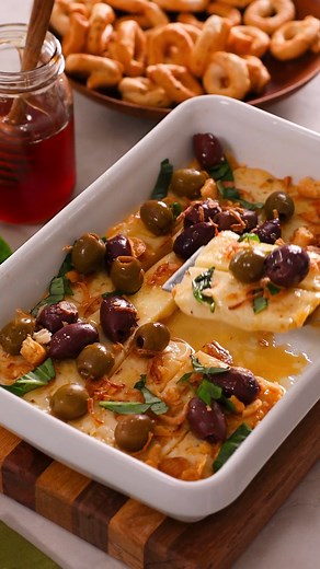 485 reactions · 123 shares | Feast your eyes on our Roasted Asiago with Hot Honey and Crispy Shallots. Imported Asiago, from Italy is sweet & nutty. We've roasted it until creamy and smooth and added a sweet and salty topping. It's the perfect party appetizer served with toasted Italian bread or crispy vegetables. Get the tasty recipe here: https://iloveimportedcheese.com/recipe/roasted-asiago-with-hot-honey-and-crispy-shallots/ | I Love Imported Cheese | Facebook