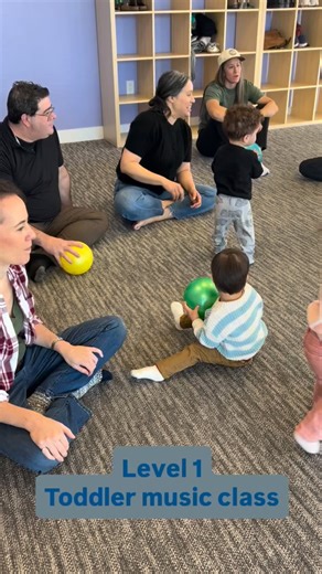 The Musik Box 🎶💜 on Instagram: "Ball play for our toddlers allows them to show off all their gross motor skills. “Watch me” is the refrain you hear most often with this age because toddlers desire to be noticed. Parents are giving them the gift of intentional time and labeling what they see their child doing, giving them a voice. Level 1 is a parent/child music class for toddlers on the move from 15-27 months 💜 In this music class, we give our toddlers plenty of space and opportunity to explo