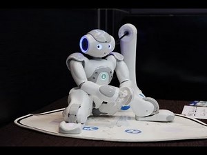 Aldebaran's NAO Robot with its new Developper only prototype of Charging Station