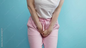 Urinary incontinence, woman holding crotch, bladder problem, pain, discomfort.