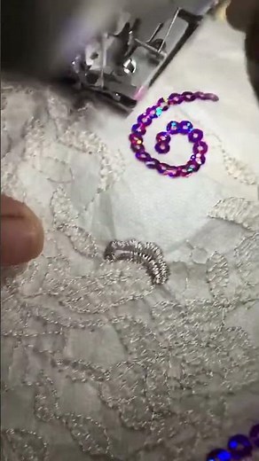 A special hand operated embroidery machine combining single gold sequins, overlapping sequins, and s