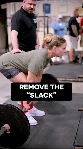 Taking the “slack” out of the bar. SSC Brent Carter explains how you can use the “click” of the plates during step 4 of the deadlift setup to help determine if you’re getting tight enough when you set your back. Removing slack from the bar and your arms when you get set helps to ensure everything stays tight and helps to resist lumbar flexion as your break it off the ground. | Starting Strength - The Aasgaard Company